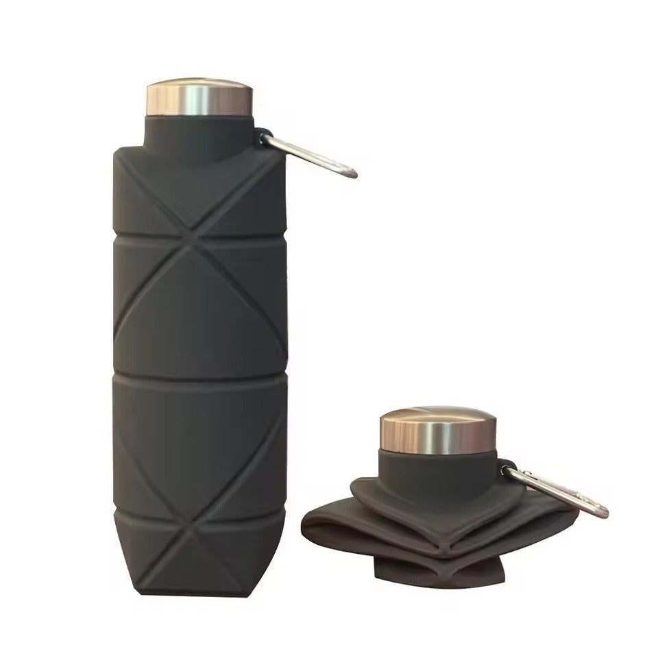 Black 500ml collapsible silicone water bottle with stainless steel cap and carabiner, shown expanded and folded, on a white background