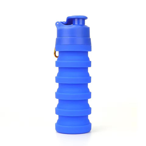 Blue 500ml collapsible silicone water bottle with flip-top sport cap and metal carry ring, on a white background