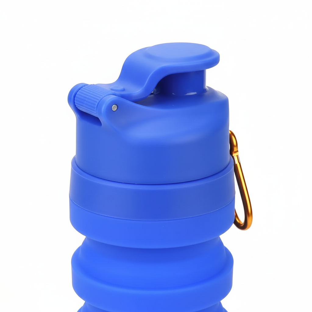 Close-up of the blue flip-top sport cap and silicone ridges of the collapsible water bottle on pure white background