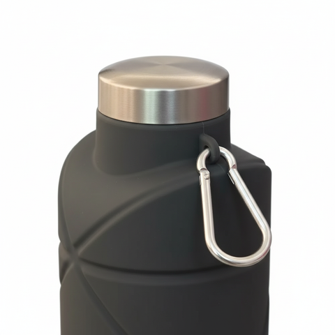 Close-up of the stainless steel cap and diamond-textured dark gray silicone body with carabiner on pure white background