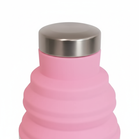 Close-up of the stainless steel leakproof cap and pink silicone ridges of the collapsible water bottle on pure white background