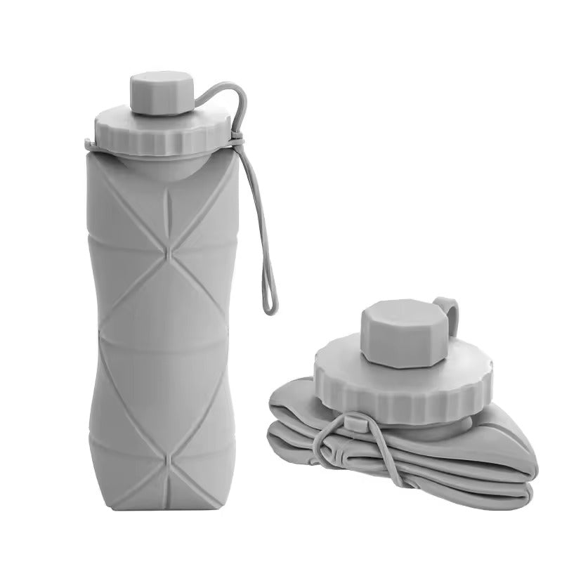 Gray 600 mL collapsible silicone water bottle with screw cap and carry loop, shown upright and folded