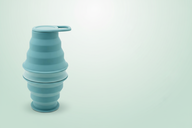 Mint 500ml collapsible bottle on a soft pastel mint banner with space for a headline
